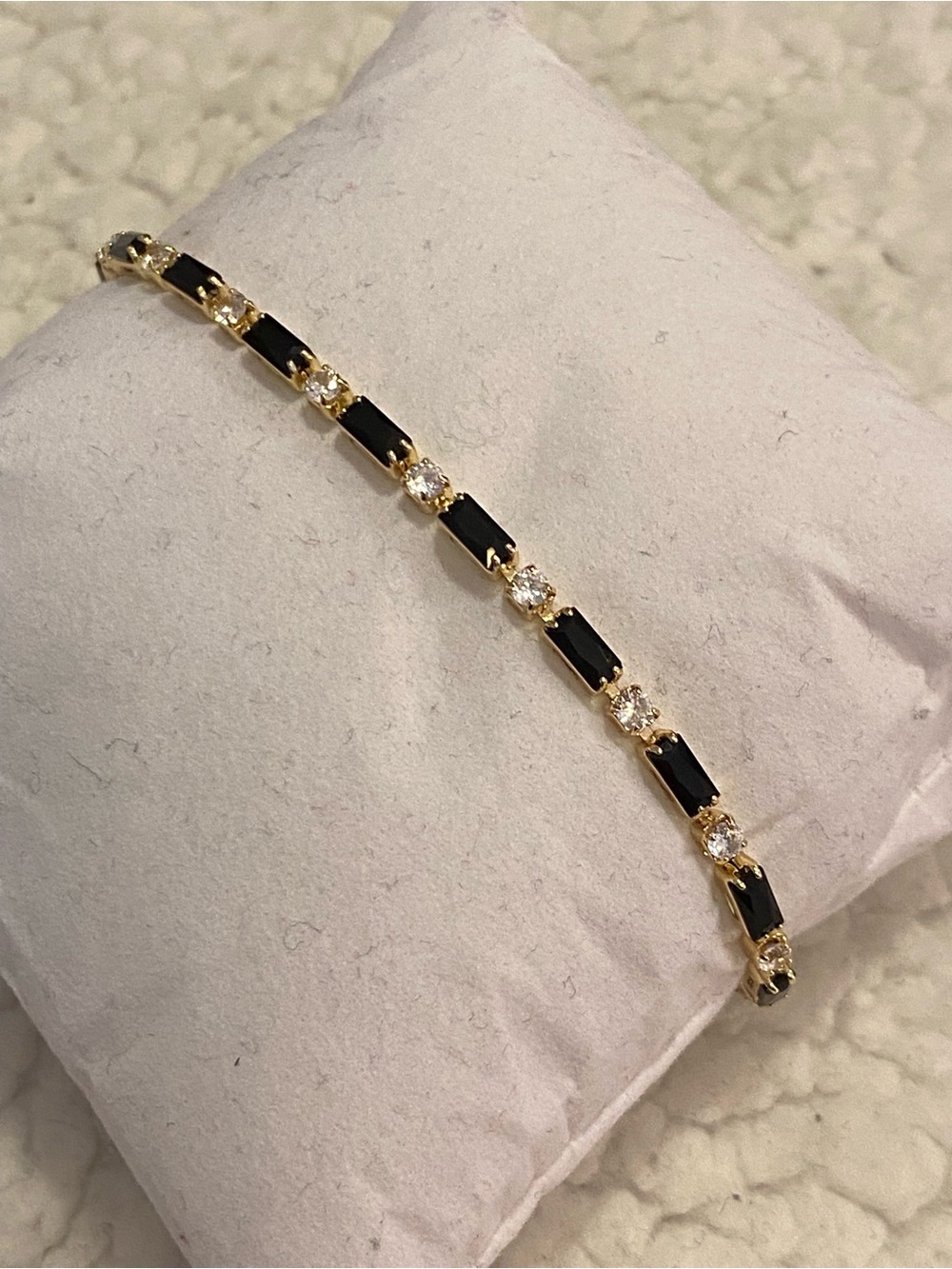 Gold-tone Bracelet with Black and Clear Stones